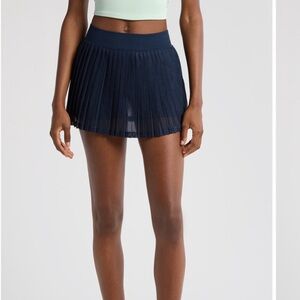 FREE PEOPLE MOVEMENT RALLY PLEATED MINISKORT LINED ELASTIC WAIST IN SHEER MESH